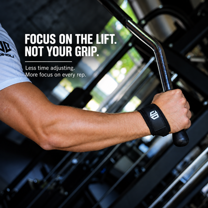 DINOLI auto-lock lifting strap worn during a gym workout, gripping a weight machine handle. Focus on the lift, not your grip.